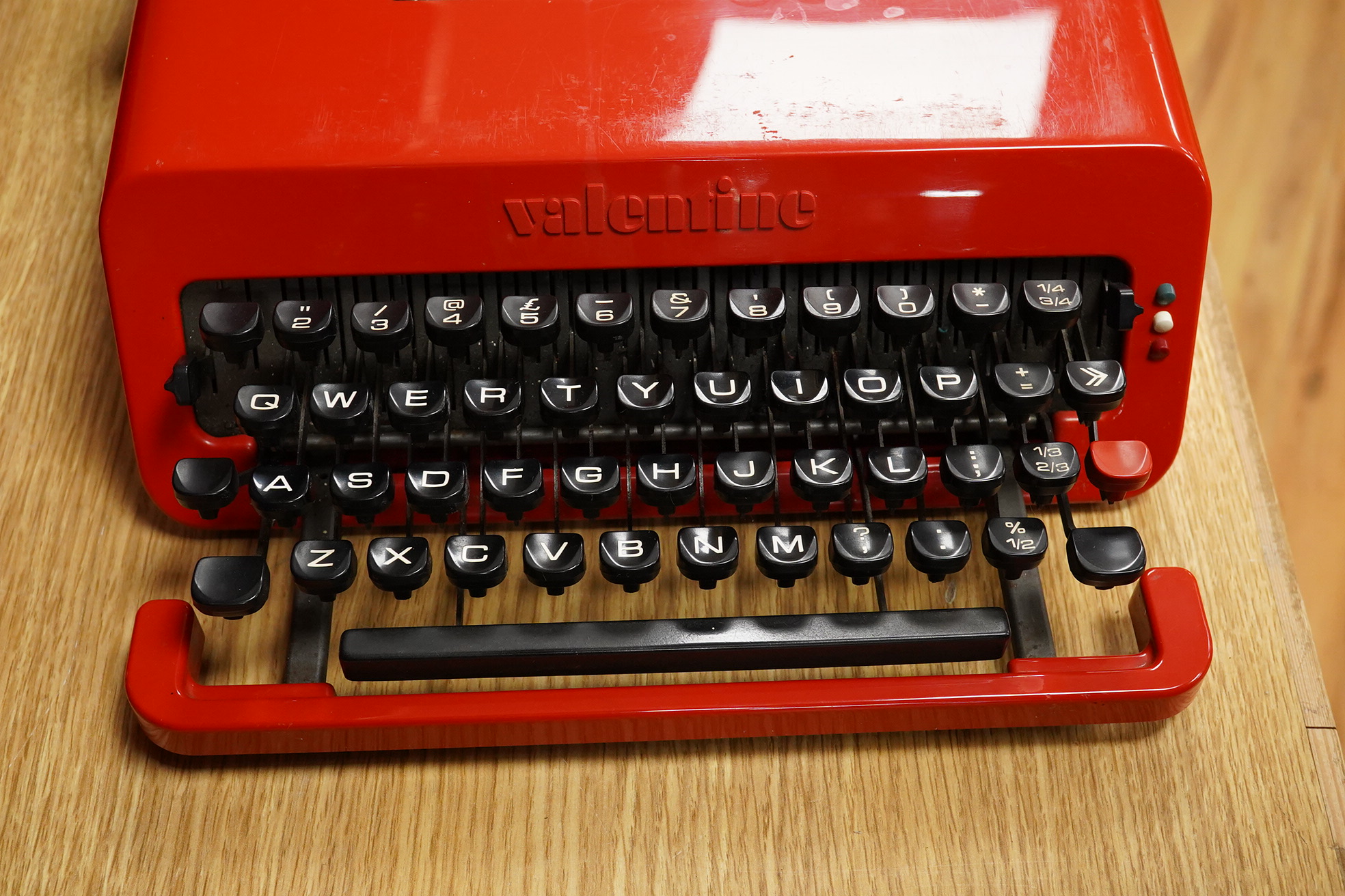 An Olivetti Valentine typewriter in red with tool case